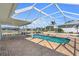 Inviting pool area with patio, perfect for outdoor relaxation and enjoying waterfront views at 1950 Fairview Dr, Englewood, FL 34223