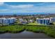Panoramic view of waterfront condos showcasing green space and the coastal landscape at 2012 Harbourside Dr # 2104, Longboat Key, FL 34228