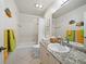 Clean bathroom featuring a granite-style countertop, ample vanity storage, and a shower and tub combo at 2012 Harbourside Dr # 2104, Longboat Key, FL 34228