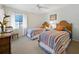 Bright and airy bedroom featuring two twin beds with colorful striped bedding and a charming bedside table at 2012 Harbourside Dr # 2104, Longboat Key, FL 34228