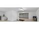 Spacious two car garage with bright lighting, offering ample storage and parking at 2012 Harbourside Dr # 2104, Longboat Key, FL 34228