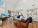 Spacious living room with vaulted ceiling and wood floors at 2012 Harbourside Dr # 2104, Longboat Key, FL 34228