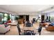 Bright lounge area with comfortable seating, tables, and a TV for residents to gather and relax at 2012 Harbourside Dr # 2104, Longboat Key, FL 34228