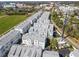 Aerial view of a residential neighborhood with modern townhomes and green spaces at 2505 Boone Ct, Sarasota, FL 34237