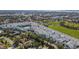 Panoramic aerial view of a community, showcasing the townhomes, landscaping, and surrounding areas at 2505 Boone Ct, Sarasota, FL 34237