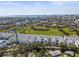 Expansive aerial view of a residential neighborhood with a cityscape backdrop and waterfront views at 2505 Boone Ct, Sarasota, FL 34237