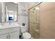 Modern bathroom featuring a glass-enclosed shower and a sleek vanity at 2505 Boone Ct, Sarasota, FL 34237