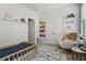 Cozy bedroom with a rocker, truck decorations, and playful road rug at 2505 Boone Ct, Sarasota, FL 34237