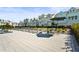 Inviting community pool surrounded by modern townhomes and lounge chairs, perfect for relaxation and socializing at 2505 Boone Ct, Sarasota, FL 34237
