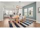 Cozy dining area with stylish chairs, a modern light fixture, and views into the kitchen at 2505 Boone Ct, Sarasota, FL 34237