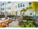 Relaxing patio featuring cozy furniture, barbecue grill, and lush landscaping at 2505 Boone Ct, Sarasota, FL 34237