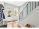 Welcoming foyer with hardwood floors and modern staircase at 2505 Boone Ct, Sarasota, FL 34237