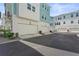 Three car garages are at the rear of the homes with paved access to the back of the units at 2505 Boone Ct, Sarasota, FL 34237