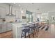 Open-concept kitchen with stainless steel appliances, a spacious island, and adjacent dining area at 2505 Boone Ct, Sarasota, FL 34237