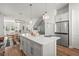 Open-concept kitchen with stainless appliances and a seamless flow to dining at 2505 Boone Ct, Sarasota, FL 34237