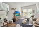 Bright living room with modern furniture, neutral tones, and plenty of natural light at 2505 Boone Ct, Sarasota, FL 34237