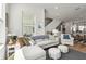 Bright living room with a comfortable sectional sofa and view of the dining area at 2505 Boone Ct, Sarasota, FL 34237