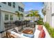 Inviting outdoor patio with comfortable seating, a grill, and views of the surrounding neighborhood at 2505 Boone Ct, Sarasota, FL 34237