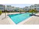 Gorgeous community pool with lounge chairs and clear blue water, perfect for relaxing at 2505 Boone Ct, Sarasota, FL 34237