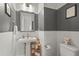 Stylish powder room with modern fixtures, two-toned walls, and sleek design at 2505 Boone Ct, Sarasota, FL 34237