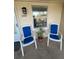 Condo balcony featuring comfortable chairs and a potted plant, perfect for relaxing at 2607 Woodgate Ln # K9, Sarasota, FL 34231