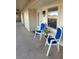 View of a cozy balcony with chairs and a plant, unit 2607 at 2607 Woodgate Ln # K9, Sarasota, FL 34231