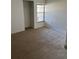 Bedroom featuring neutral carpet, large window for natural light, and closet at 2607 Woodgate Ln # K9, Sarasota, FL 34231
