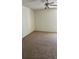 Carpeted bedroom featuring a ceiling fan and a window at 2607 Woodgate Ln # K9, Sarasota, FL 34231