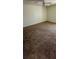 Spacious carpeted bedroom featuring a ceiling fan and ample space at 2607 Woodgate Ln # K9, Sarasota, FL 34231