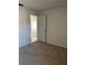Bedroom doorway with a view into an adjacent room with a chandelier at 2607 Woodgate Ln # K9, Sarasota, FL 34231