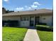 Charming single-story home with well-maintained lawn, walkway, and visible house number for easy identification at 2607 Woodgate Ln # K9, Sarasota, FL 34231