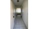 Inviting tiled hallway leading into a bright and spacious condo unit at 2607 Woodgate Ln # K9, Sarasota, FL 34231