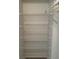 Linen closet with multiple wire shelves offering practical storage solutions at 2607 Woodgate Ln # K9, Sarasota, FL 34231