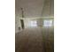 Spacious, carpeted living room with large mirrored wall at 2607 Woodgate Ln # K9, Sarasota, FL 34231