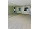 Living area with mirrored wall leading into kitchen at 2607 Woodgate Ln # K9, Sarasota, FL 34231