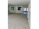 Comfortable living area with mirrored wall accents, and an adjacent entrance view at 2607 Woodgate Ln # K9, Sarasota, FL 34231