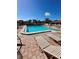Beautiful community pool area with lounge chairs and tables, perfect for relaxation and outdoor enjoyment at 2607 Woodgate Ln # K9, Sarasota, FL 34231