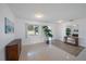 Bright room featuring ample natural light, terrazzo floor, and a decorative plant at 3048 Lockwood Ter, Sarasota, FL 34231