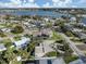 Aerial view showcasing the property's location with waterfront views and a neighborhood with mature trees at 333 Bayshore Dr, Venice, FL 34285