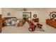 Spacious main bedroom featuring tiled floor, sliding glass door to the outside, and comfortable seating at 333 Bayshore Dr, Venice, FL 34285