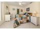 Cozy bedroom with a patchwork quilt, desk area, and bright, natural lighting at 333 Bayshore Dr, Venice, FL 34285