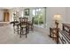 Cozy breakfast nook with barstool seating and view to lush landscaping at 333 Bayshore Dr, Venice, FL 34285