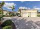 Beautiful single-story home boasting a paver driveway, a two-car garage, and decorative glass front door at 333 Bayshore Dr, Venice, FL 34285