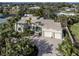 Stunning home with lush landscaping, brick driveway and attached two-car garage, and decorative front door at 333 Bayshore Dr, Venice, FL 34285