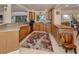 Stylish kitchen with stainless steel appliances, wood cabinets, and large island at 333 Bayshore Dr, Venice, FL 34285