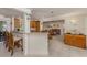Open-concept living space featuring tile flooring, a breakfast bar, and a view of the dining area at 333 Bayshore Dr, Venice, FL 34285