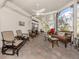 Spacious screened patio with comfortable seating and ceiling fan at 333 Bayshore Dr, Venice, FL 34285