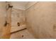 Tiled walk-in shower with built-in bench and modern shower head at 333 Bayshore Dr, Venice, FL 34285