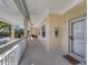 Comfortable condominium balcony entrance with white railings and outdoor seating at 3803 54Th W Dr # 203, Bradenton, FL 34210