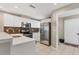 Well-appointed kitchen featuring stainless steel appliances and white cabinetry at 3803 54Th W Dr # 203, Bradenton, FL 34210